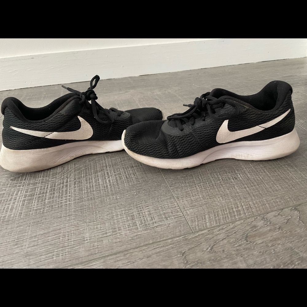 Womens black and white Nike running shoes